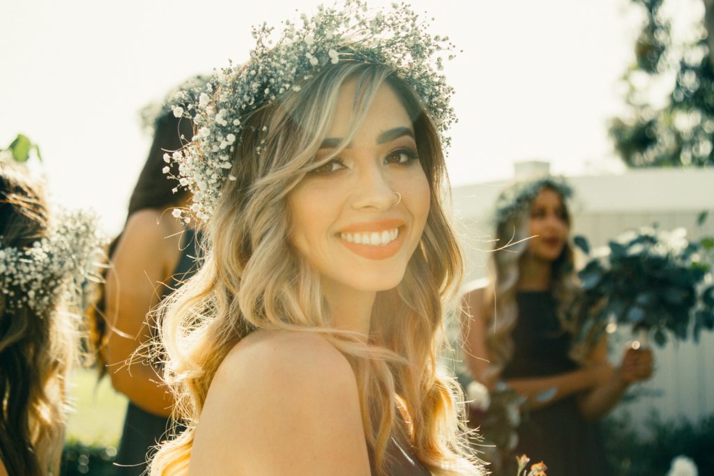wedding guest with flower crown and waves